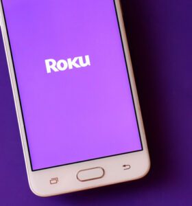 Roku with purple background on phone screen