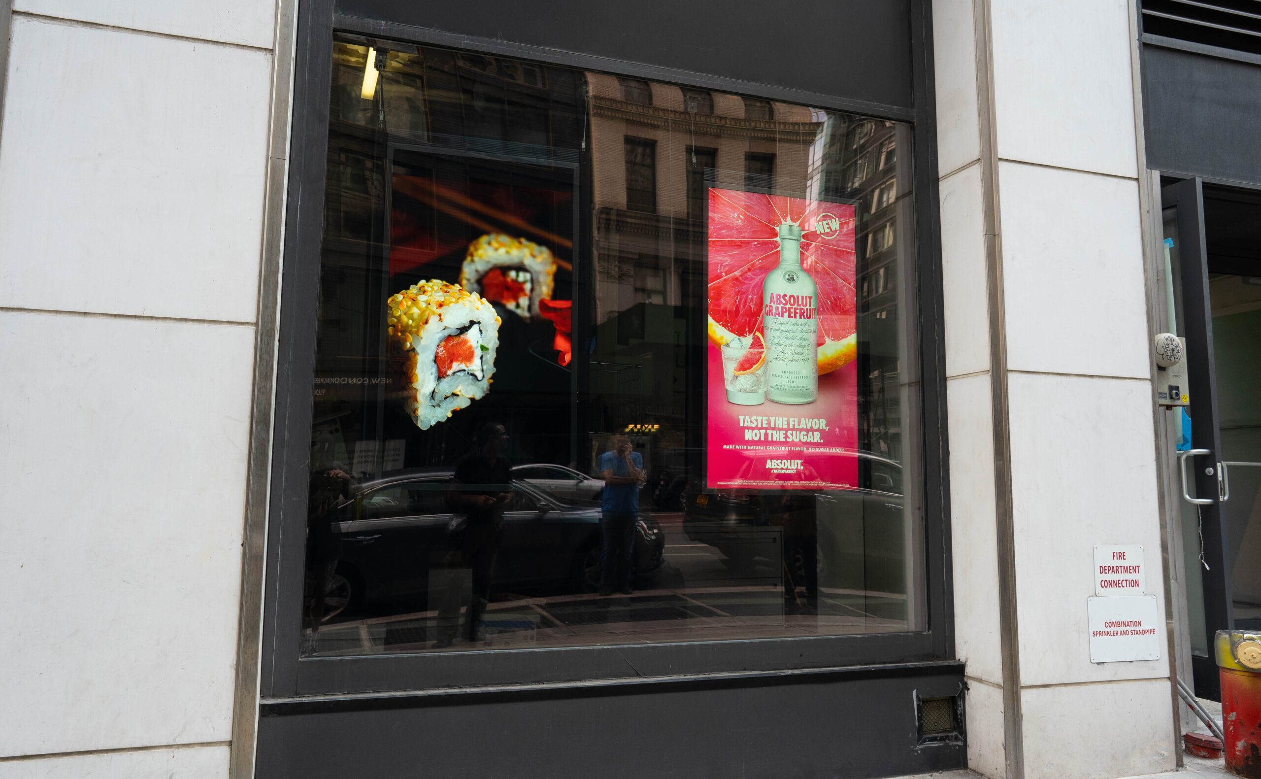 Smartify Media screens in a storefront window.