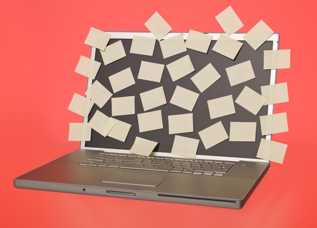 Post-it notes on a laptop